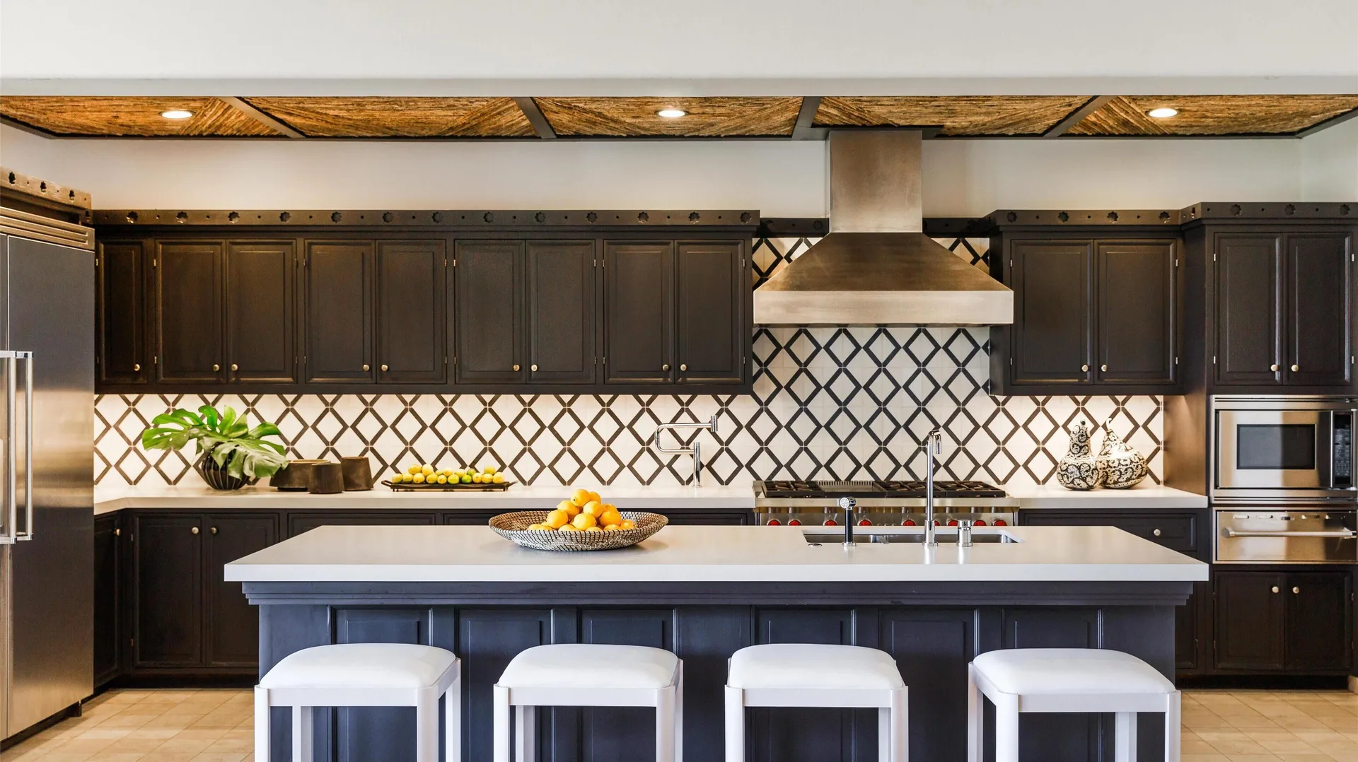 Casa Santa Maria kitchen with island seating at Montage Los Cabos.