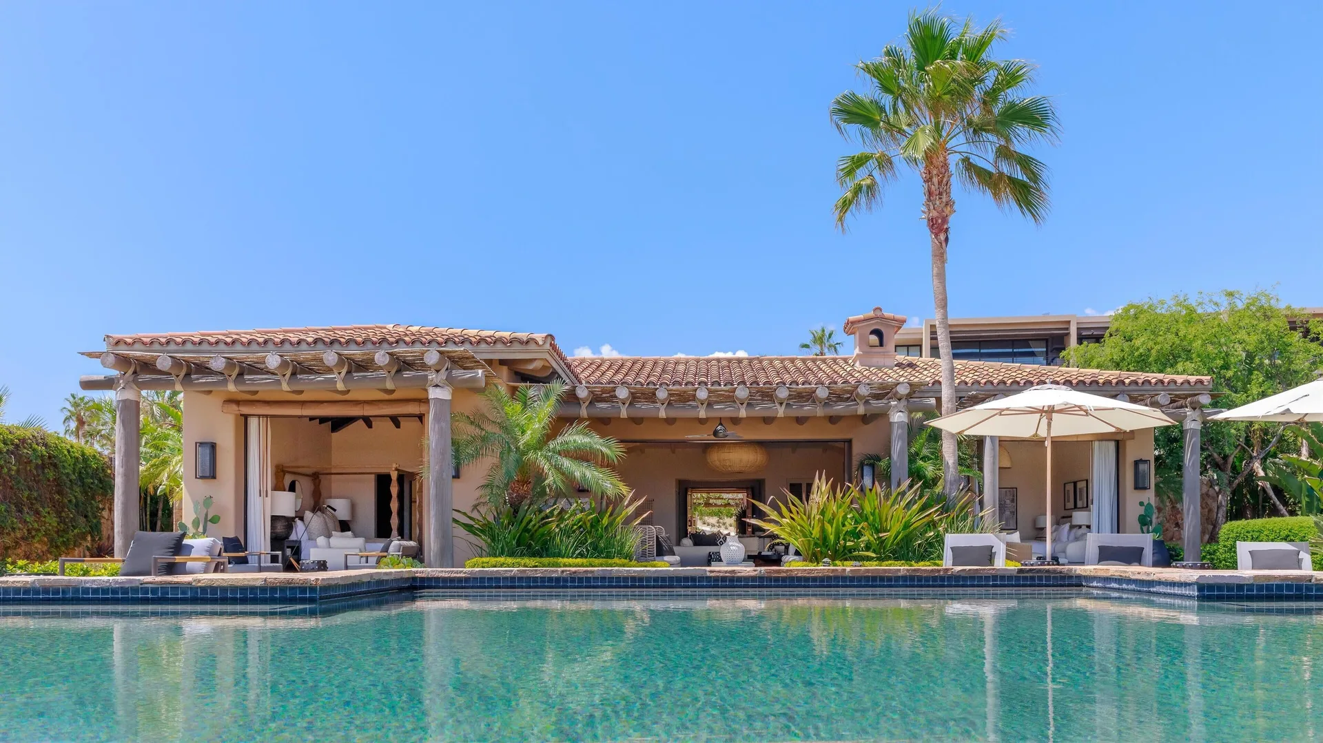 Casa Santa Maria at Montage Los Cabos viewed across a pool in daylight.