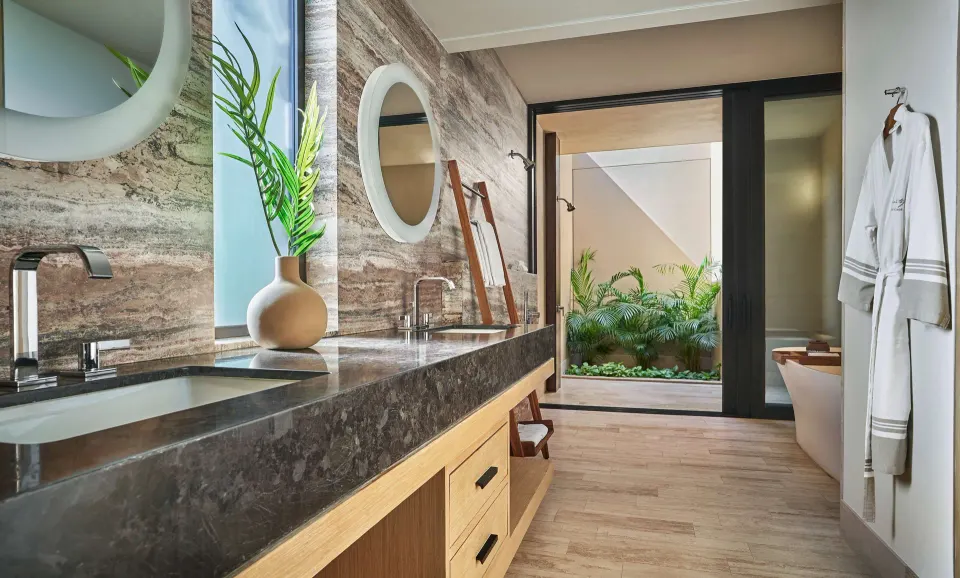 Accessible room bathroom with double vanity and soaking tub at Montage Los Cabos.