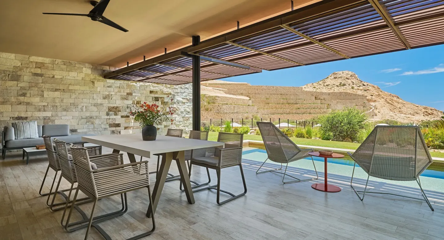Outdoor dining terrace and pool at a Coastal View suite at Montage Los Cabos.
