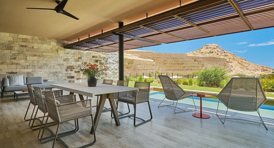 Outdoor dining terrace and pool at a Coastal View suite at Montage Los Cabos.