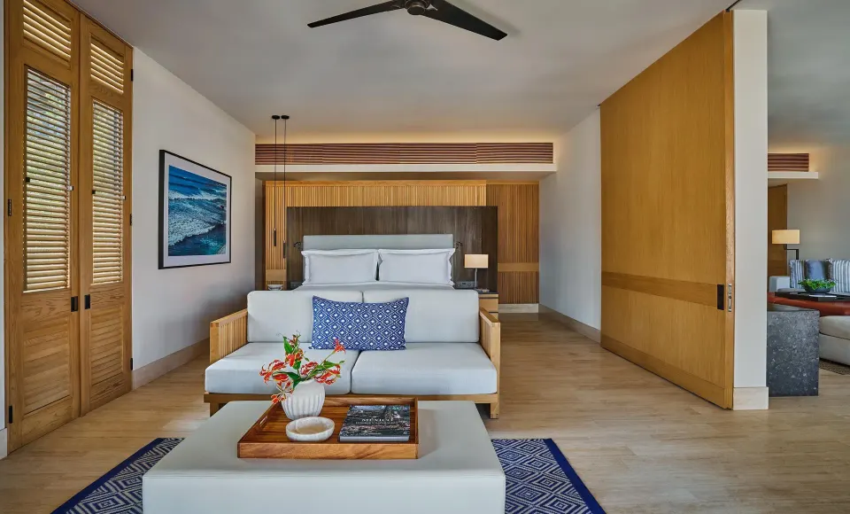 Deluxe Ocean View One Bedroom Suite king bedroom with sitting area at Montage Los Cabos.