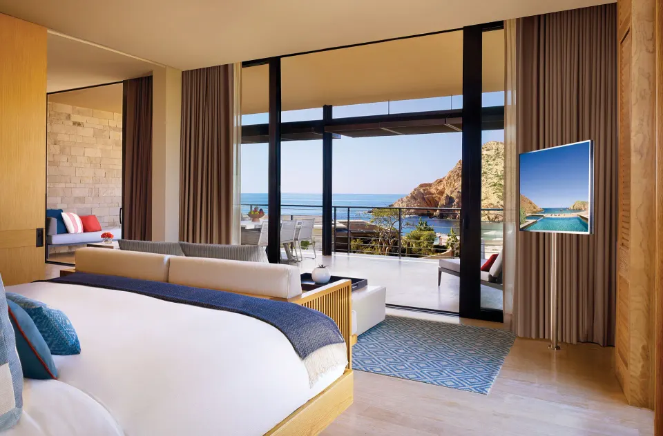 Deluxe Ocean View One Bedroom Suite king bed and terrace at Montage Los Cabos.