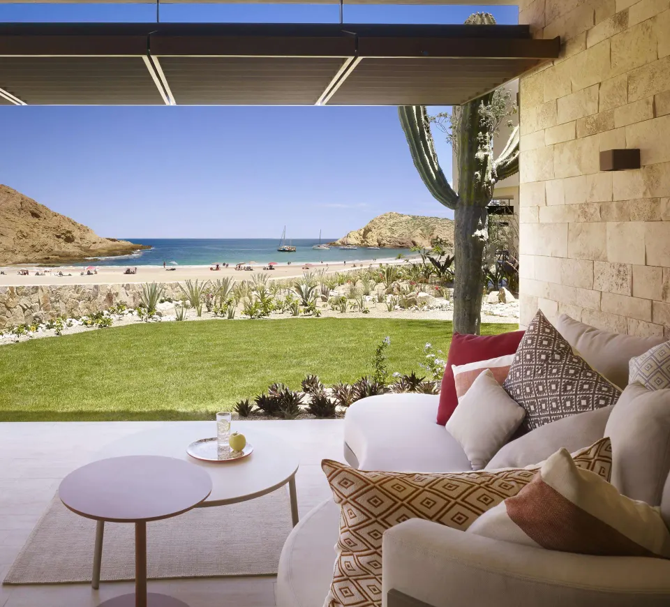 Deluxe Ocean View Two Bedroom Suite terrace seating with beach view at Montage Los Cabos.
