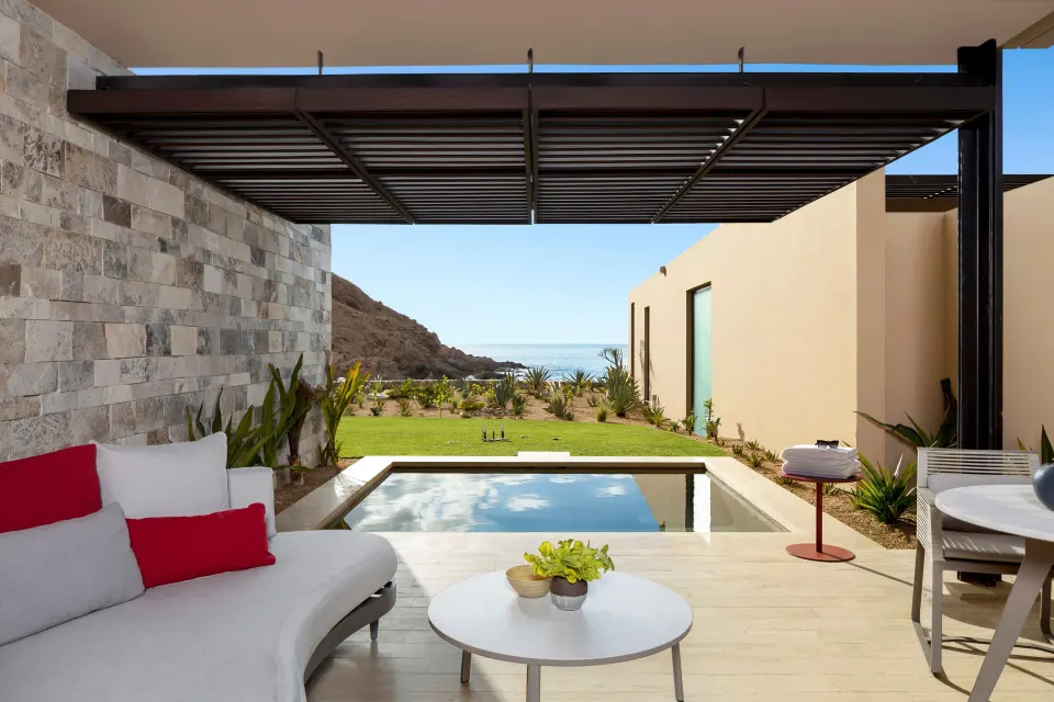 Deluxe Ocean View with Pool terrace at Montage Los Cabos with plunge pool, seating, lawn and ocean view.