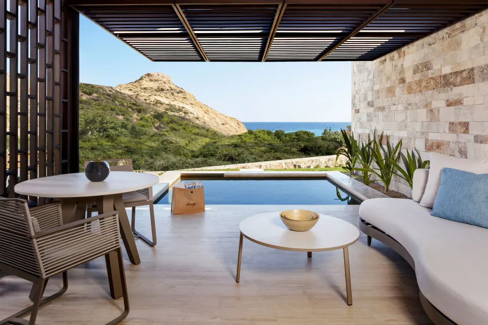 Deluxe Ocean View with Pool terrace at Montage Los Cabos with plunge pool, lounge seating, hillside and ocean.