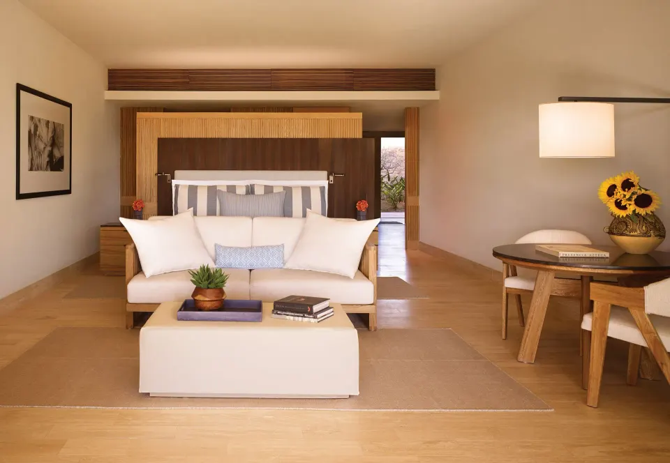 Ocean Front Two Bedroom Suite bedroom with seating area at Montage Los Cabos.