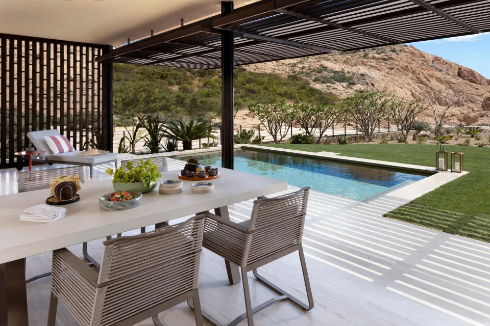 Ocean Front Two Bedroom Suite patio dining beside the pool at Montage Los Cabos.
