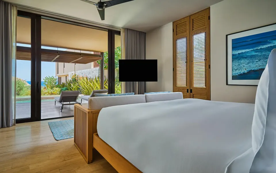 Ocean View One Bedroom Suite king bed facing pool terrace at Montage Los Cabos.