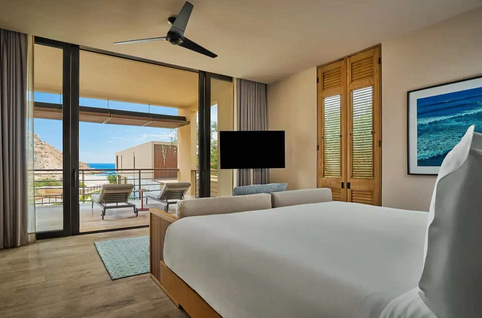 Ocean View One Bedroom Suite king bed with terrace and ocean beyond at Montage Los Cabos.