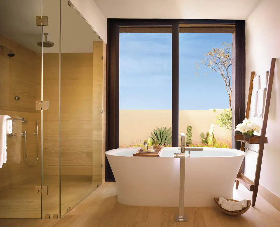 Ocean View Two Bedroom Residence bathroom with soaking tub and glass shower at Montage Los Cabos.