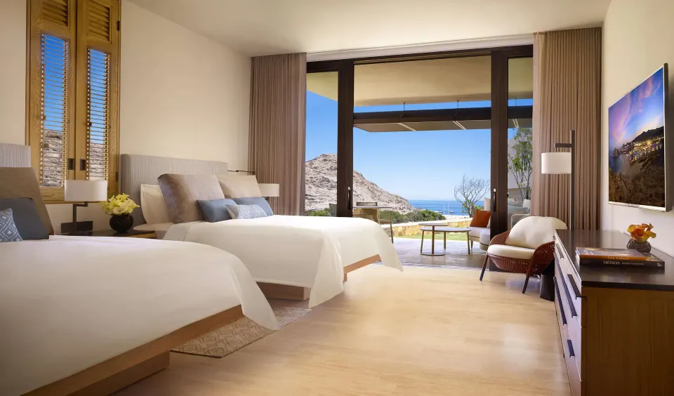 Ocean View Two Bedroom Suite with two beds and balcony view at Montage Los Cabos.