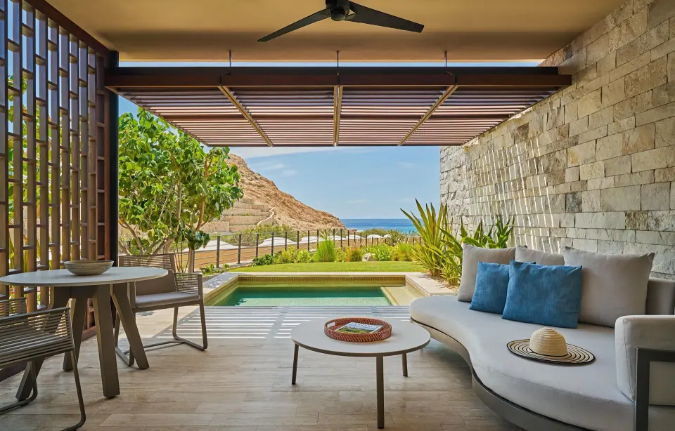 Ocean View with Pool terrace with sofa, table, and sea view at Montage Los Cabos.