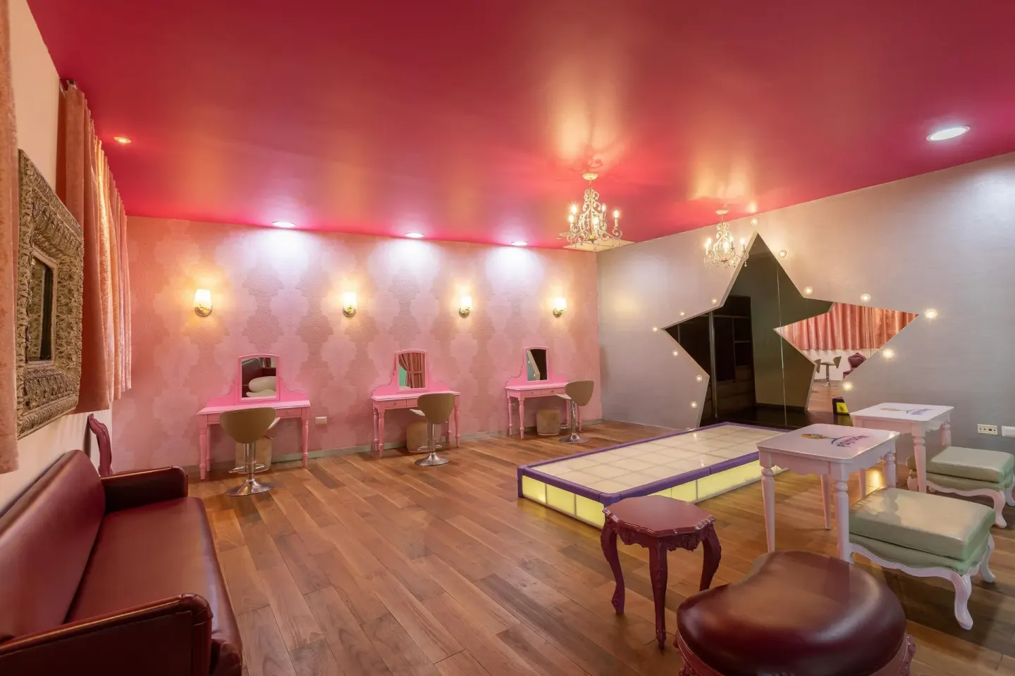 Glam room with lit runway, vanities and star mirror at Moon Palace Cancun.