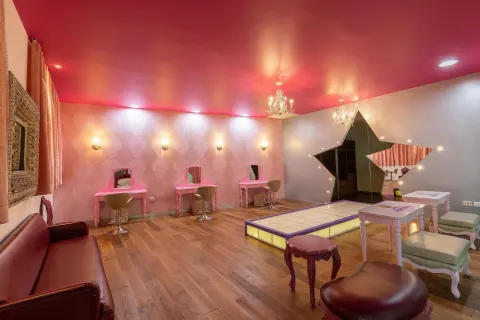 Glam room with lit runway, vanities and star mirror at Moon Palace Cancun.