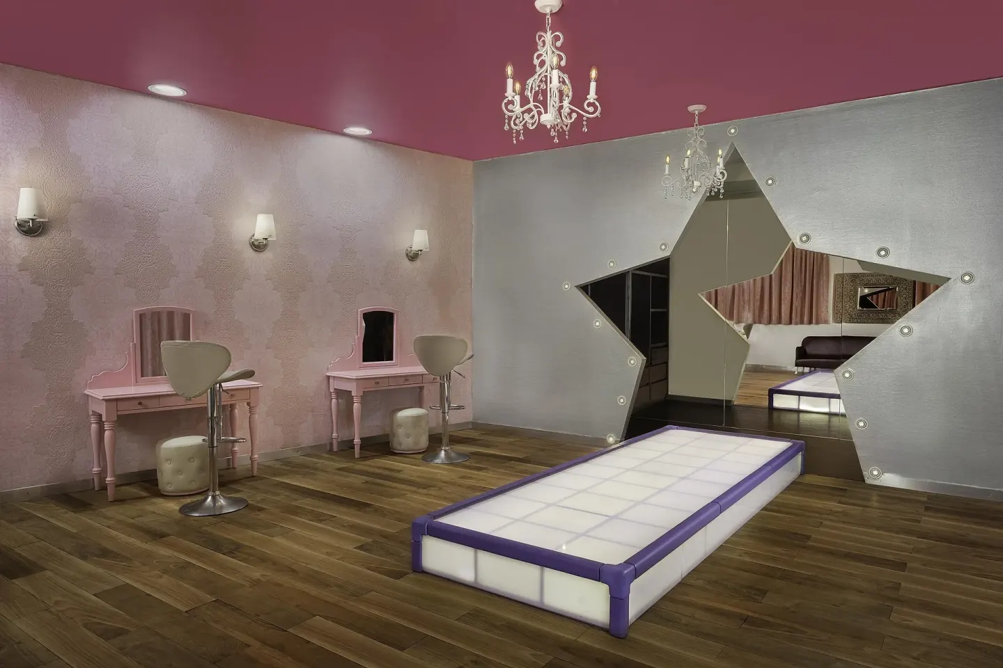 Glam room with pink vanities, chandeliers and a lighted platform at Moon Palace Cancun.