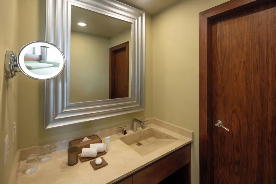 Superior Deluxe Garden View bathroom vanity with mirror at Moon Palace Cancun.