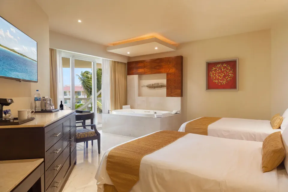 Superior Deluxe Garden View room with two beds and whirlpool tub at Moon Palace Cancun.