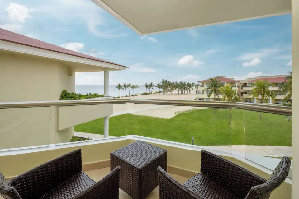 Furnished ocean-view balcony at Moon Palace Cancun.