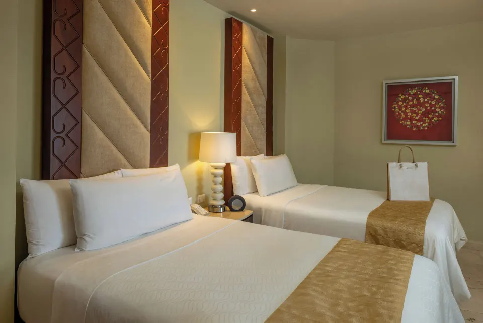Superior Deluxe Ocean View room with two double beds at Moon Palace Cancun.