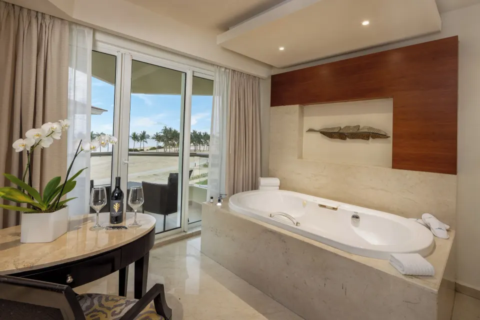 Superior Deluxe Ocean View whirlpool tub by balcony doors at Moon Palace Cancun.