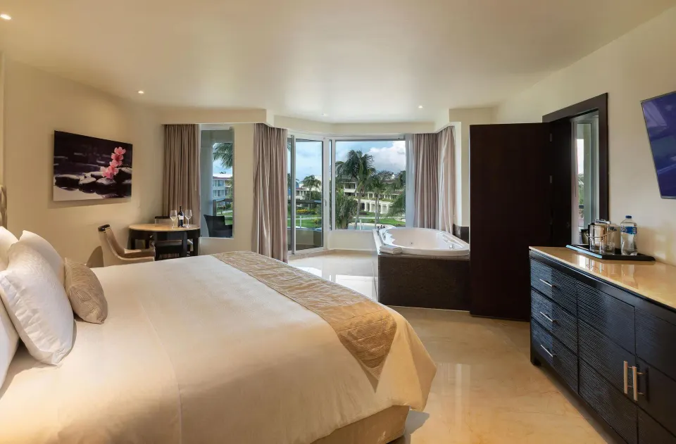 Superior Family Deluxe king-bed room with tub and balcony view at Moon Palace Cancun.