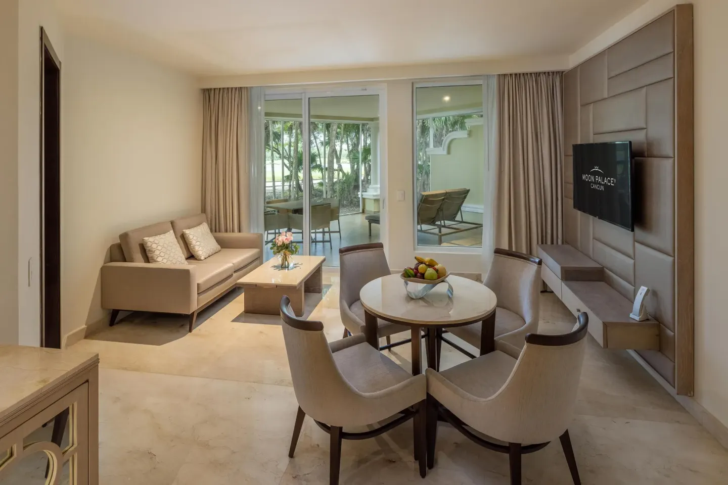 Living and dining area in a Superior Two Bedroom Suite at Moon Palace Cancun.
