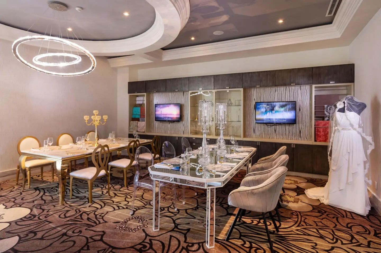 Private event room with set tables and a wedding dress at Moon Palace Cancun.
