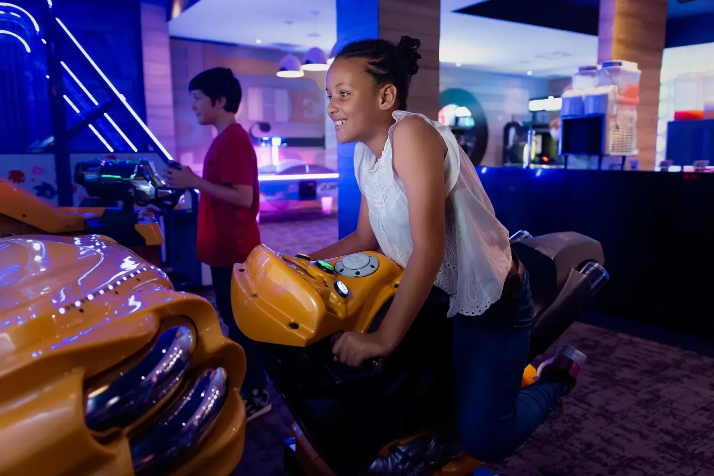 Children play arcade racing games at Moon Palace Jamaica.