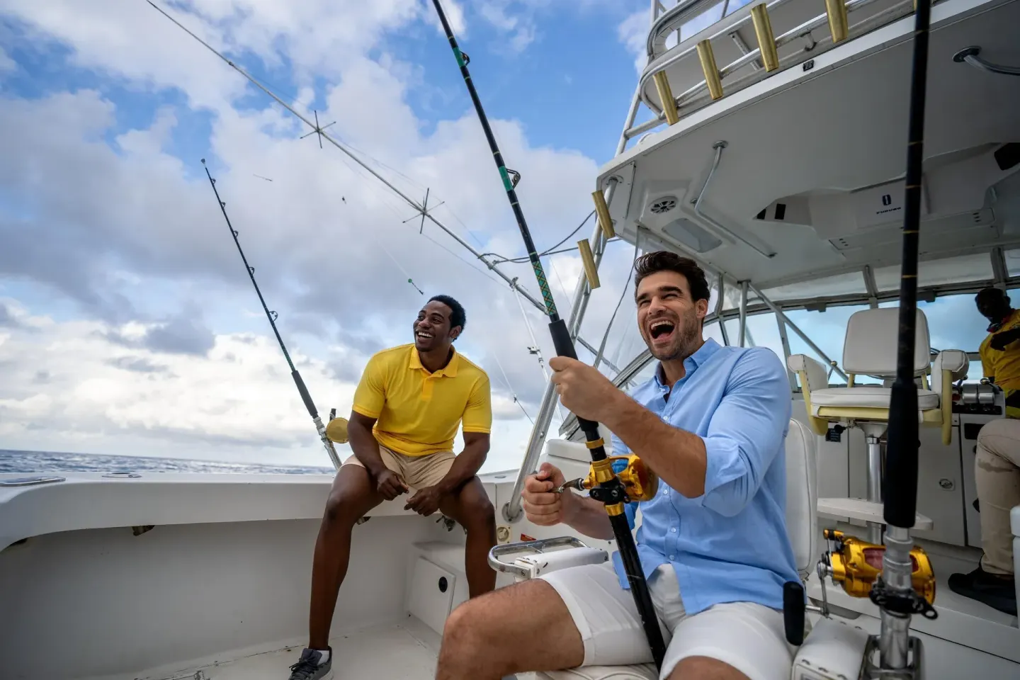 Guests fishing from a boat with rods over the ocean at Moon Palace Jamaica.