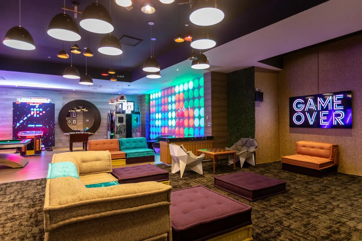 A colorful game lounge with arcade machines at Moon Palace Jamaica.