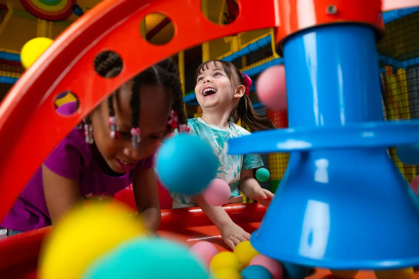 Children play in a colorful indoor play area at Moon Palace Jamaica.