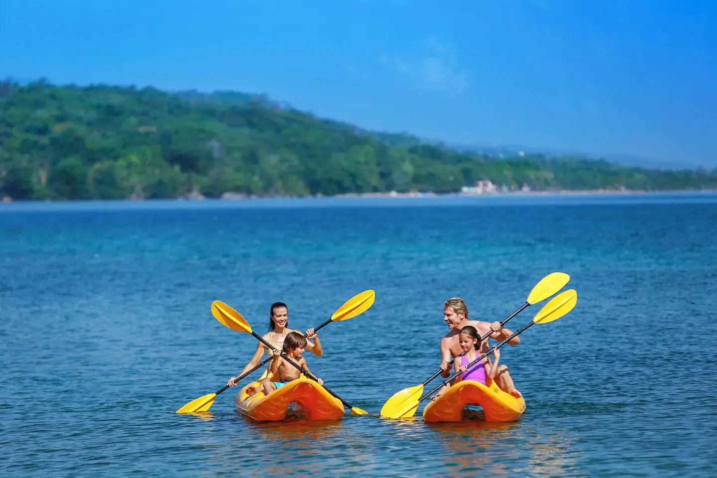 Guests kayak on calm blue water near Moon Palace Jamaica.