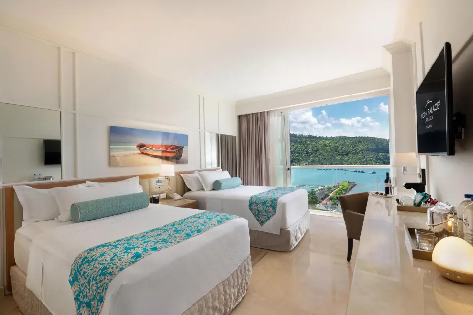 Two-bed ocean-view bedroom in a suite at Moon Palace Jamaica.