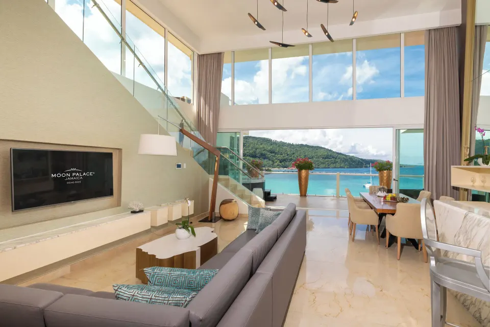 Three Bedroom Villa living room with staircase and sea view at Moon Palace Jamaica.
