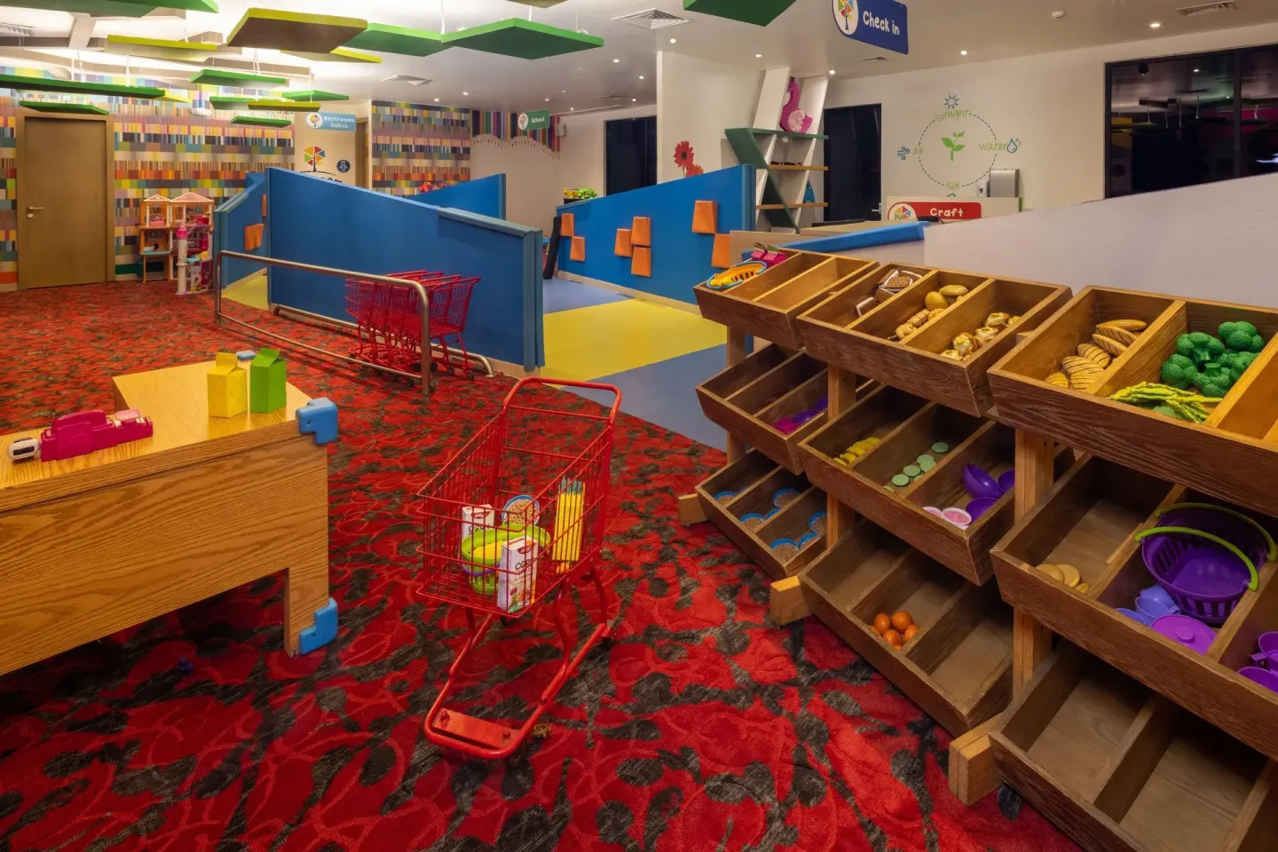 Play market with toy carts and produce bins in the kids club at Moon Palace Nizuc.