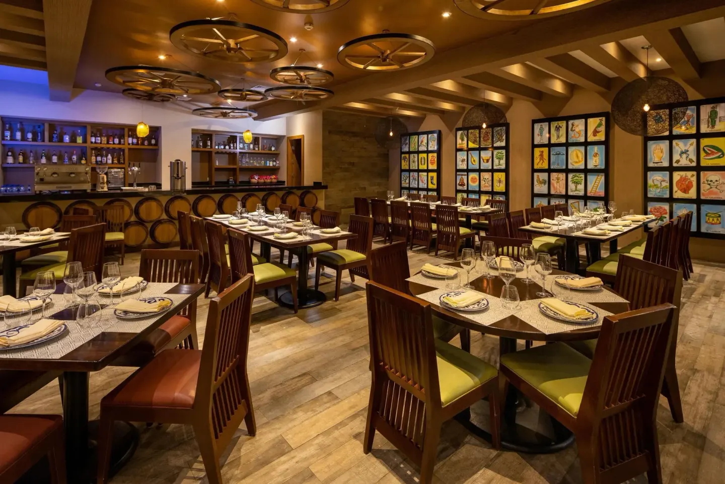 Mexican restaurant dining room with bar and folk art panels at Moon Palace Nizuc.