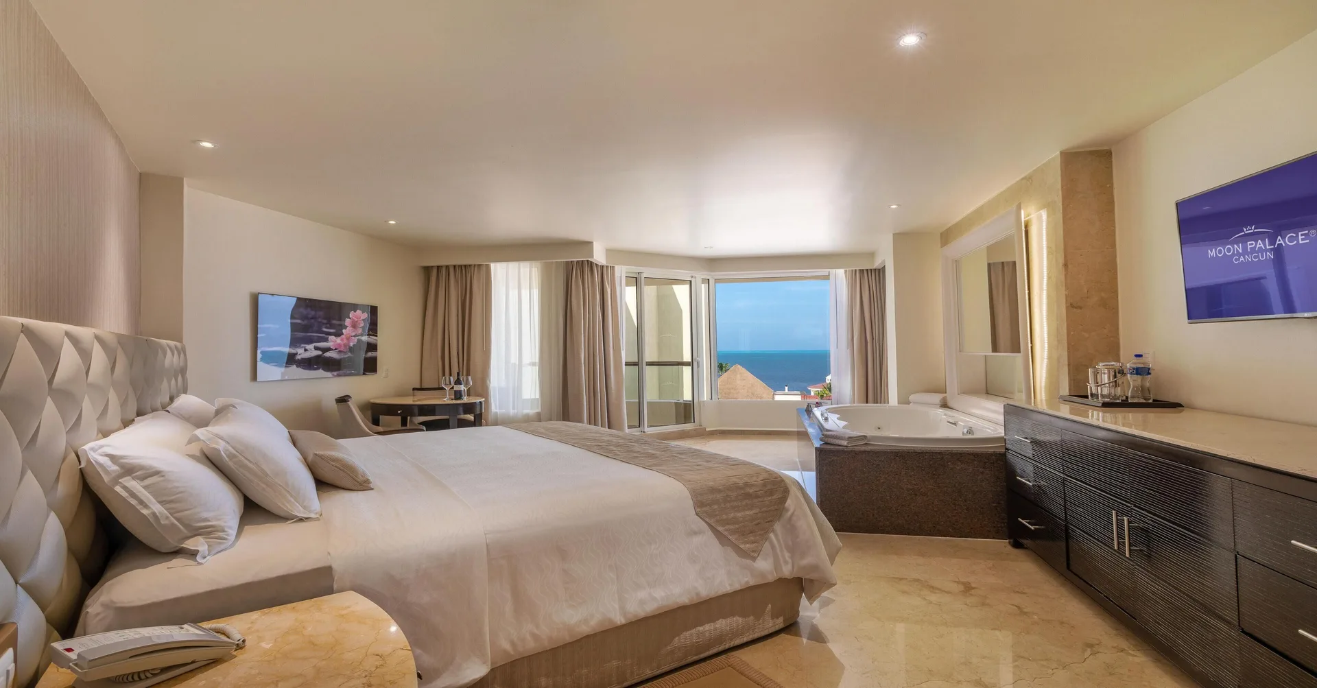 Superior Deluxe Ocean View guest room with king bed and in-room tub at Moon Palace Nizuc.