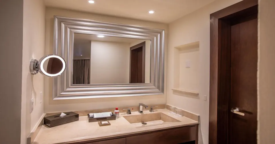 Bathroom vanity with large mirror in a family suite at Moon Palace Nizuc.