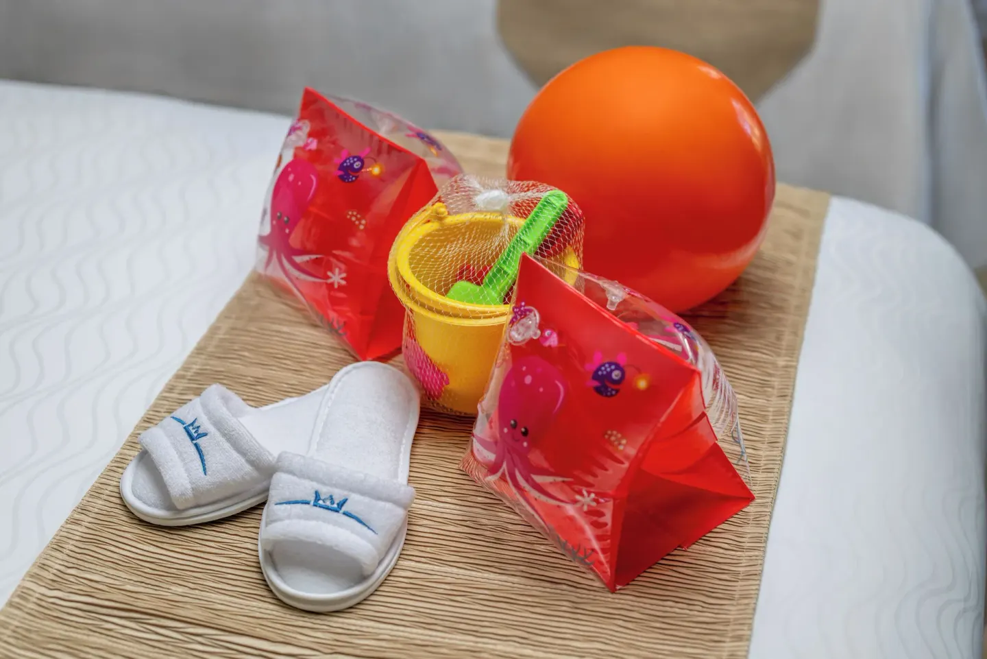Kids' welcome items on a bed in a family suite at Moon Palace Nizuc.