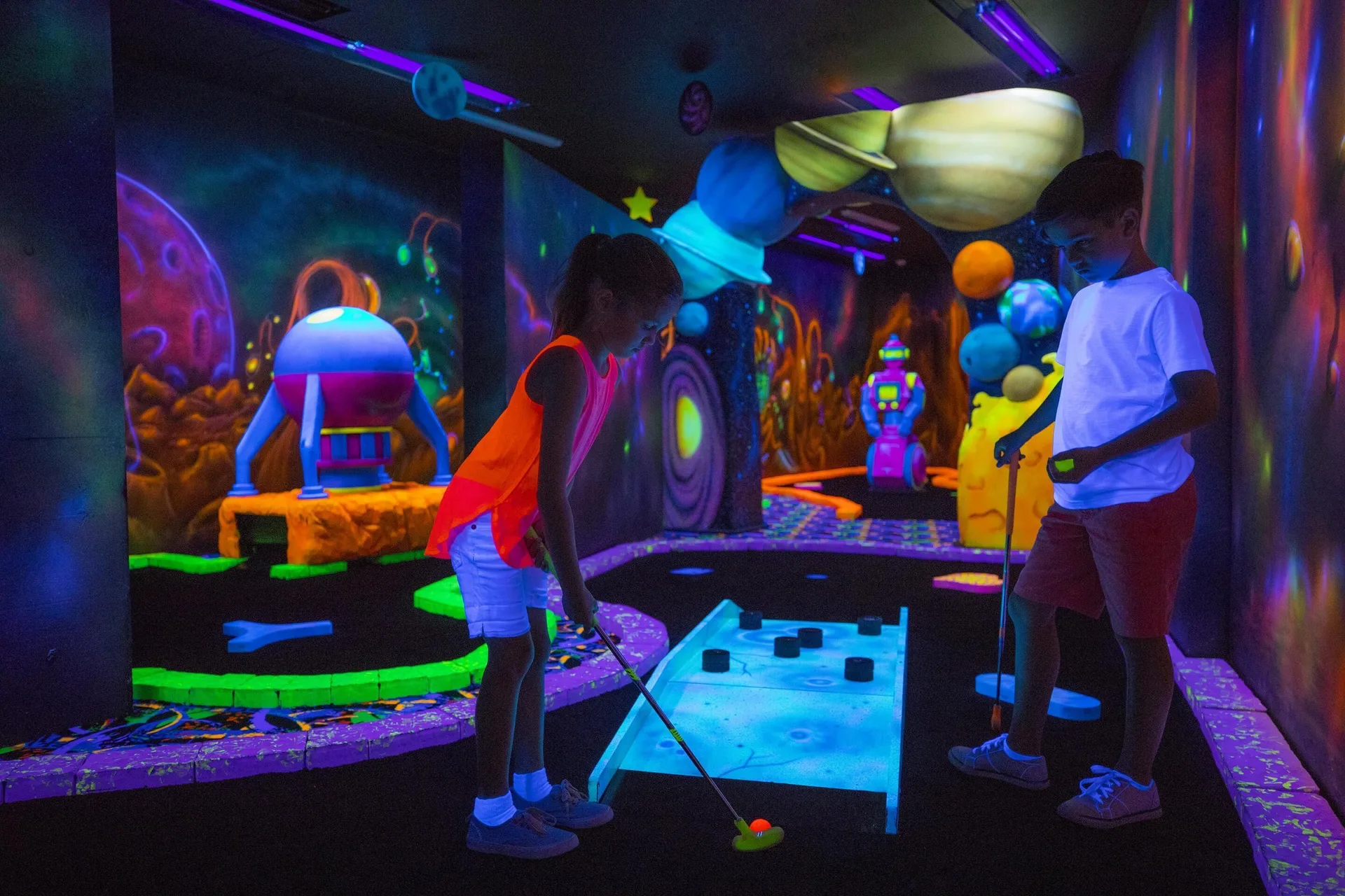 Children playing glow mini golf at Moon Palace The Grand Cancun.