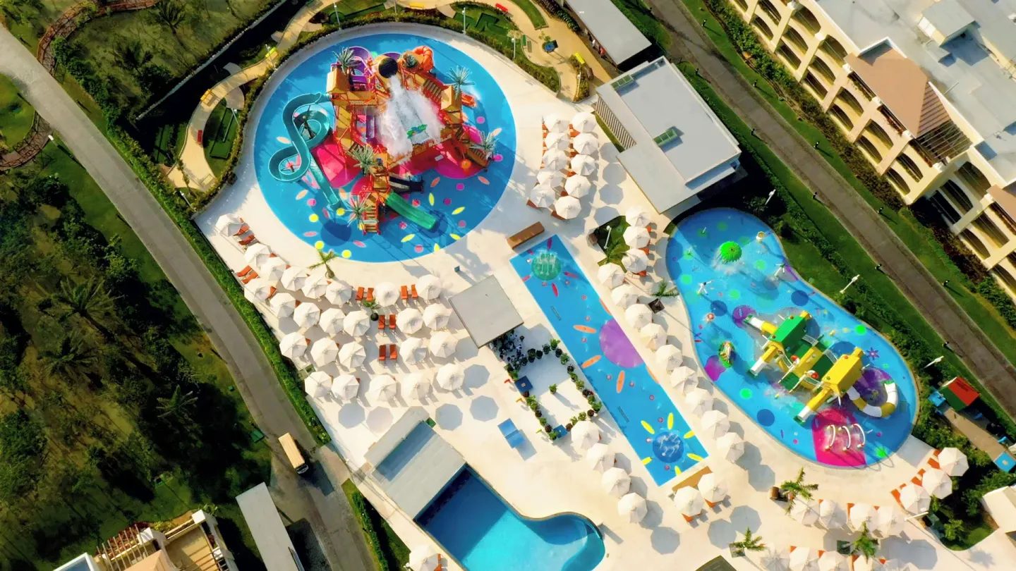 Overhead view of colorful splash pools at Moon Palace The Grand Cancun.