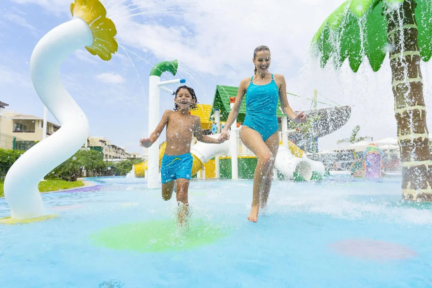 Children running through spraying water at Moon Palace The Grand Cancun.