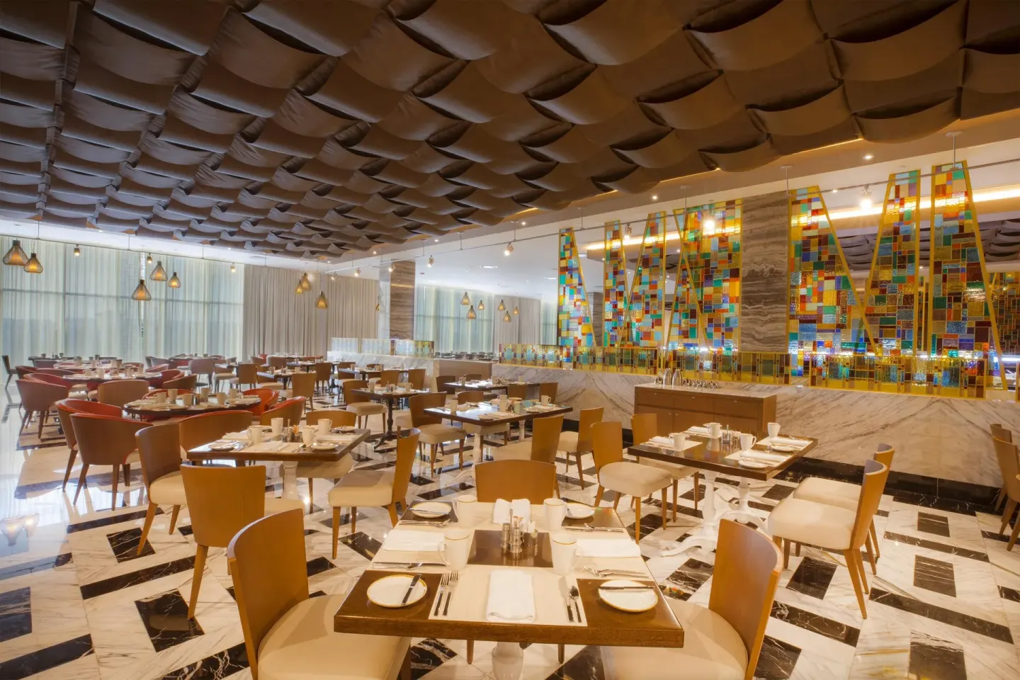 Bright buffet dining room with set tables at Moon Palace The Grand Cancun.
