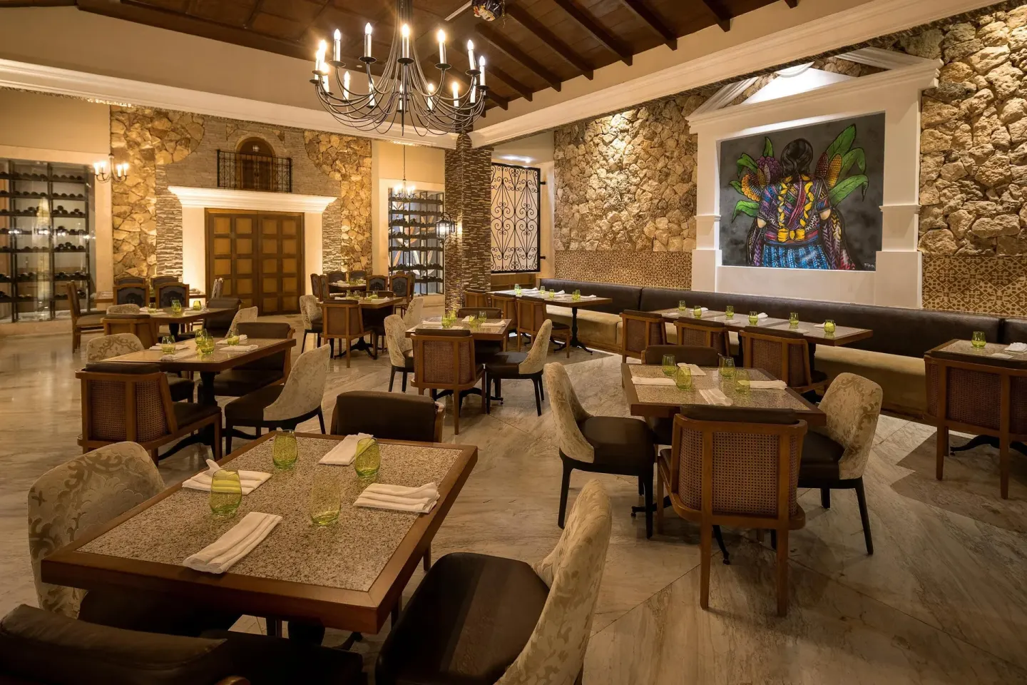 Mexican restaurant dining room with stone walls at Moon Palace The Grand Cancun.