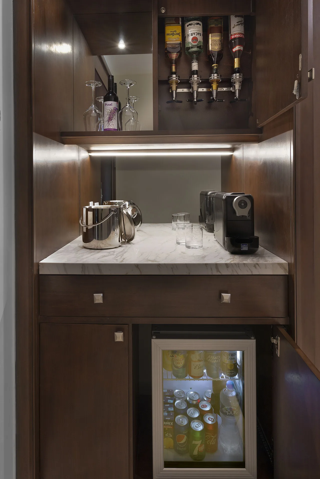 Grand Deluxe Garden View minibar and beverage cabinet at Moon Palace The Grand Cancun.