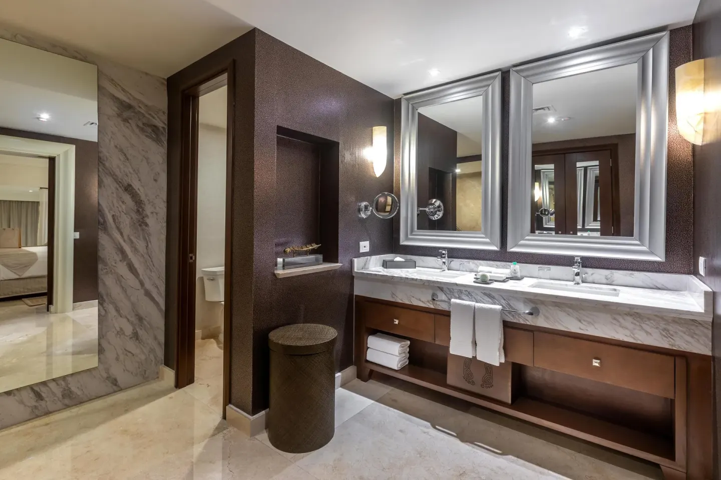Grand Presidential Suite bathroom at Moon Palace The Grand Cancun with marble vanity and dressing mirror.