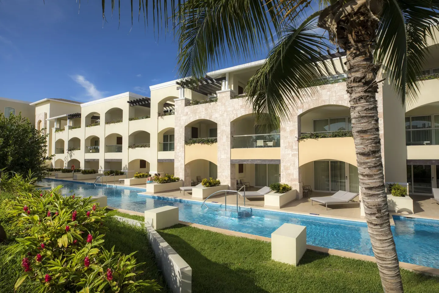 Grand Swim Up Suite Garden View building and pool at Moon Palace The Grand Cancun.