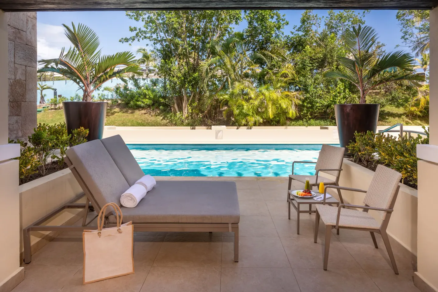 Grand Swim Up Suite Garden View terrace with loungers at Moon Palace The Grand Cancun.