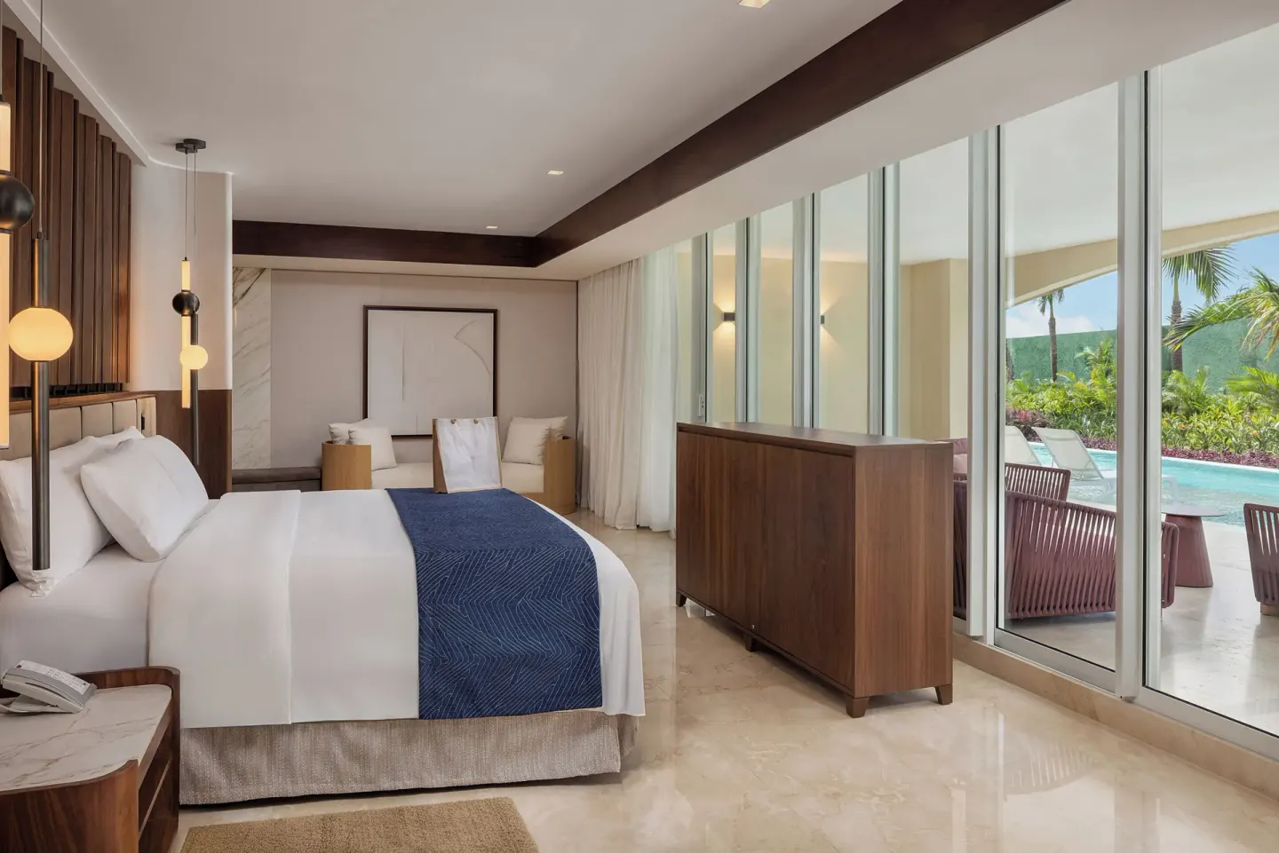 Grand Villa Pool Three Bedroom king bedroom at Moon Palace The Grand Cancun with poolside patio visible.